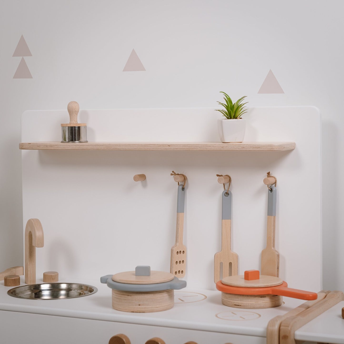 Toy kitchen combined with small shelving